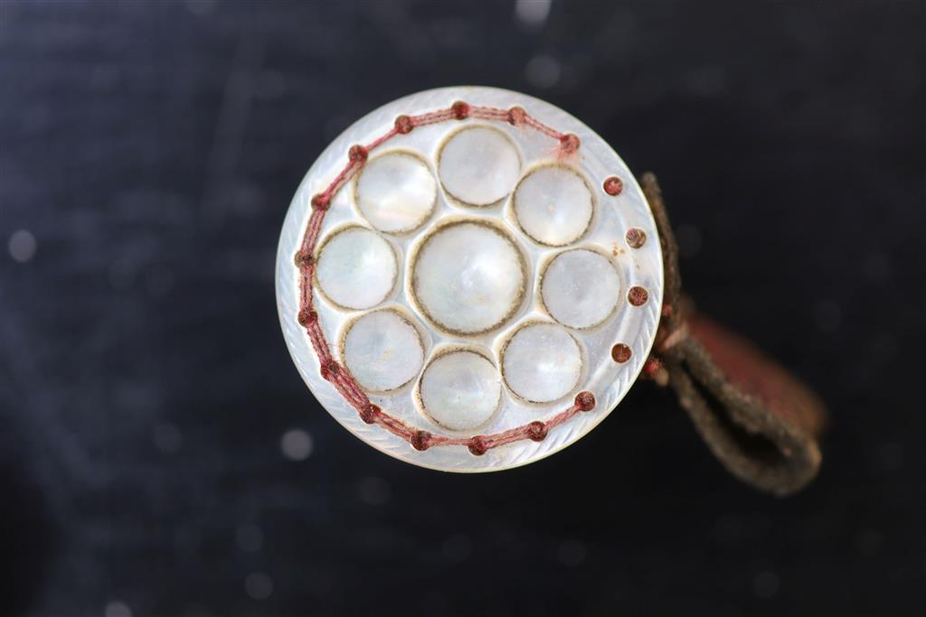 Eight assorted 19th century mother of pearl mounted pin cushions